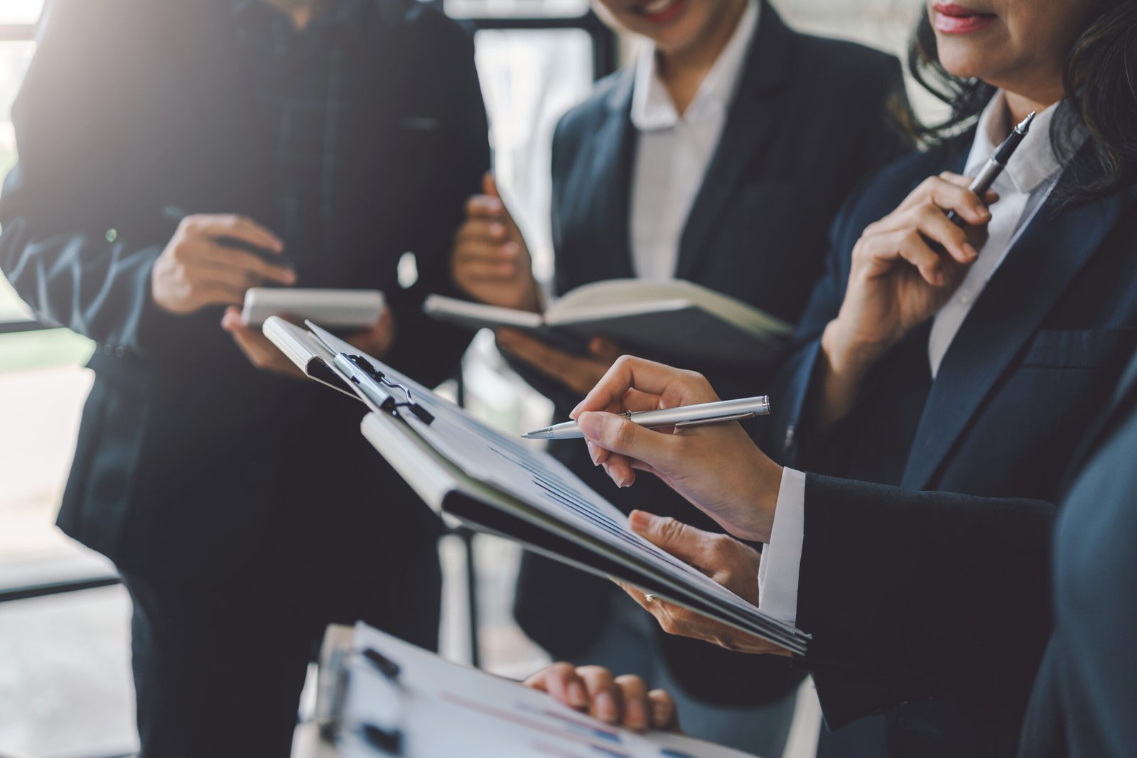 group of business people stand together to discuss 2026 01 08 06 49 52 utc scaled